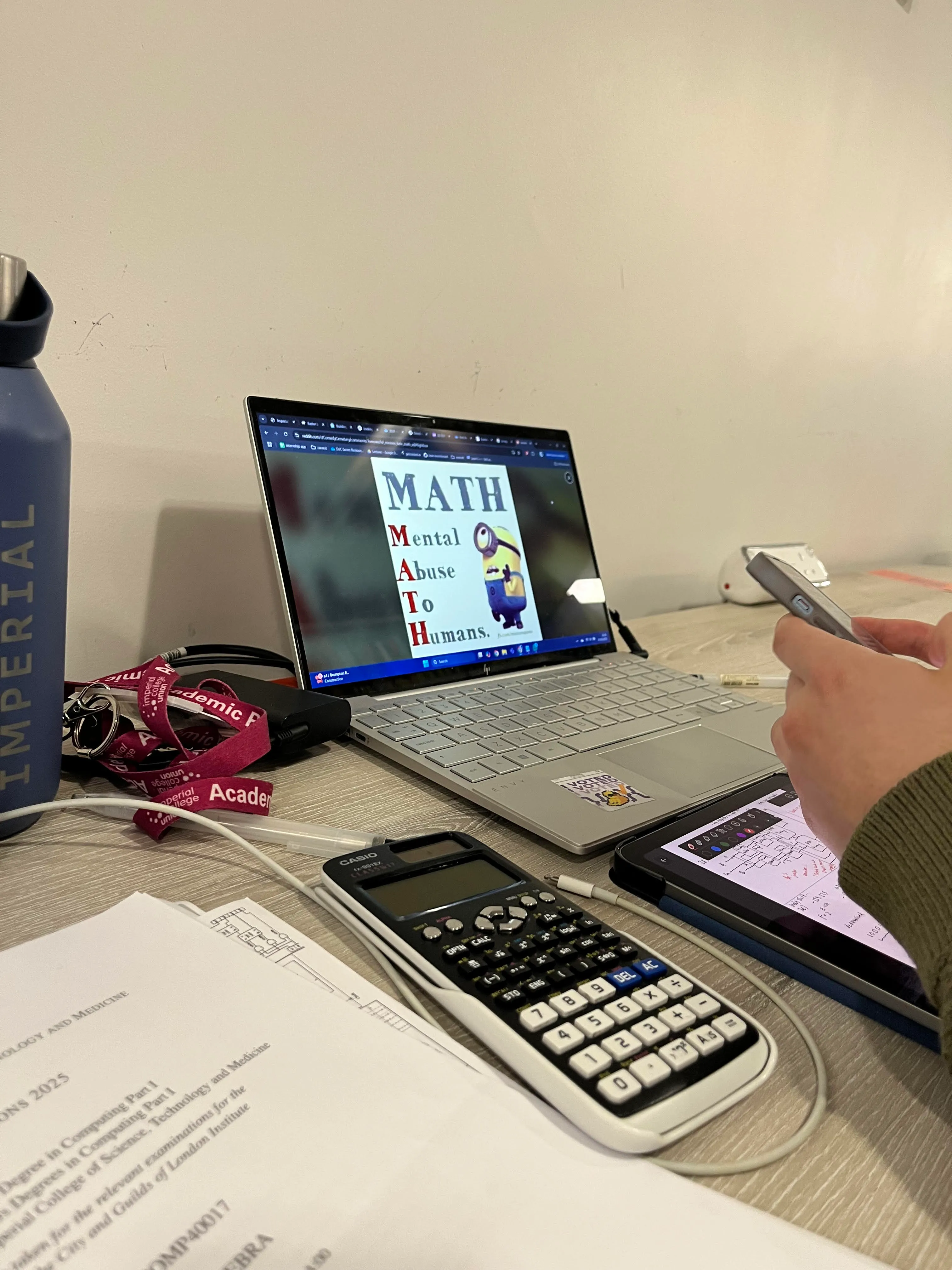 Computer screen with MATH text (Mental Abuse To Humans) on it